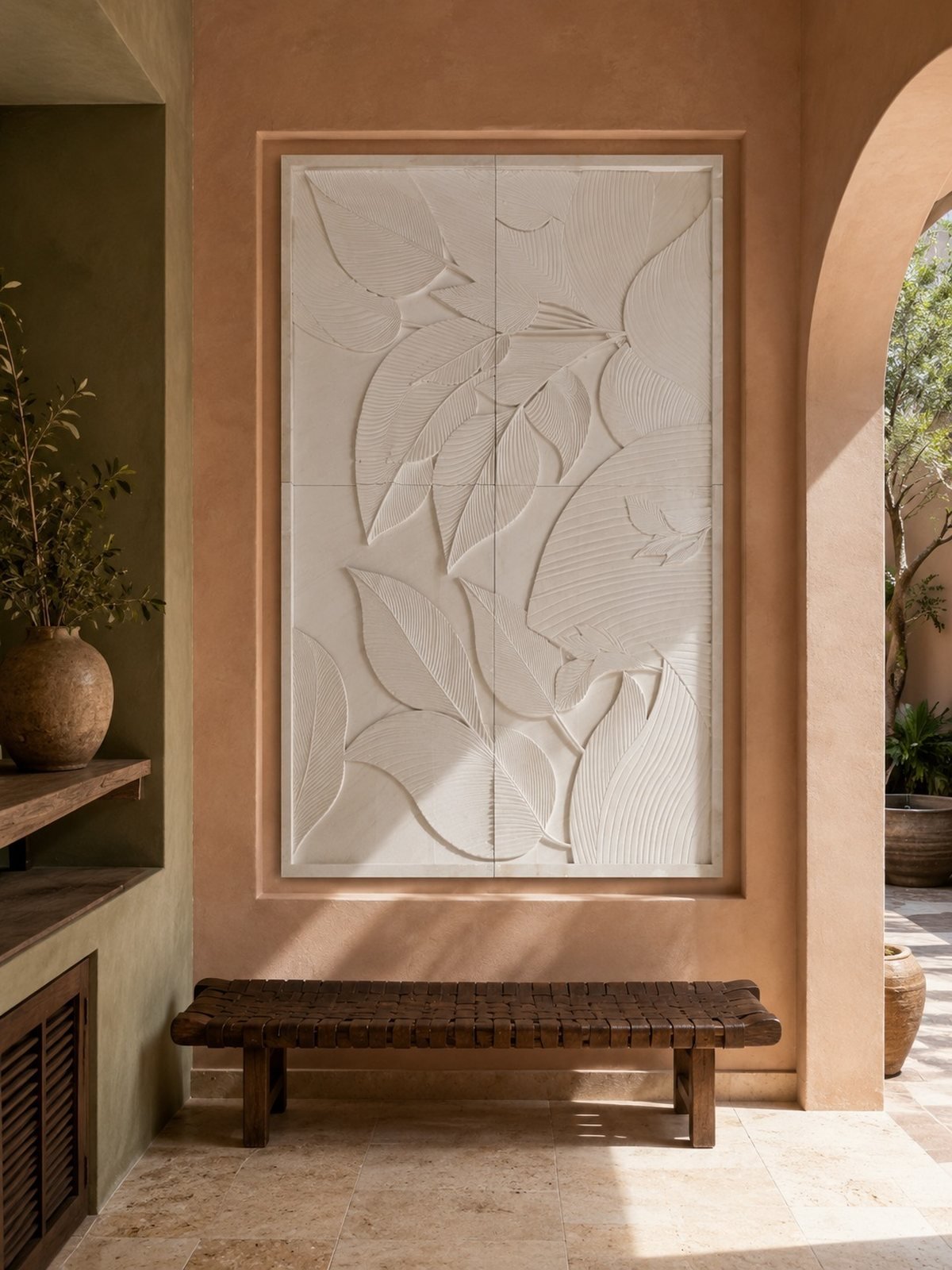 Four-panel banana leaf relief carved in cream limestone